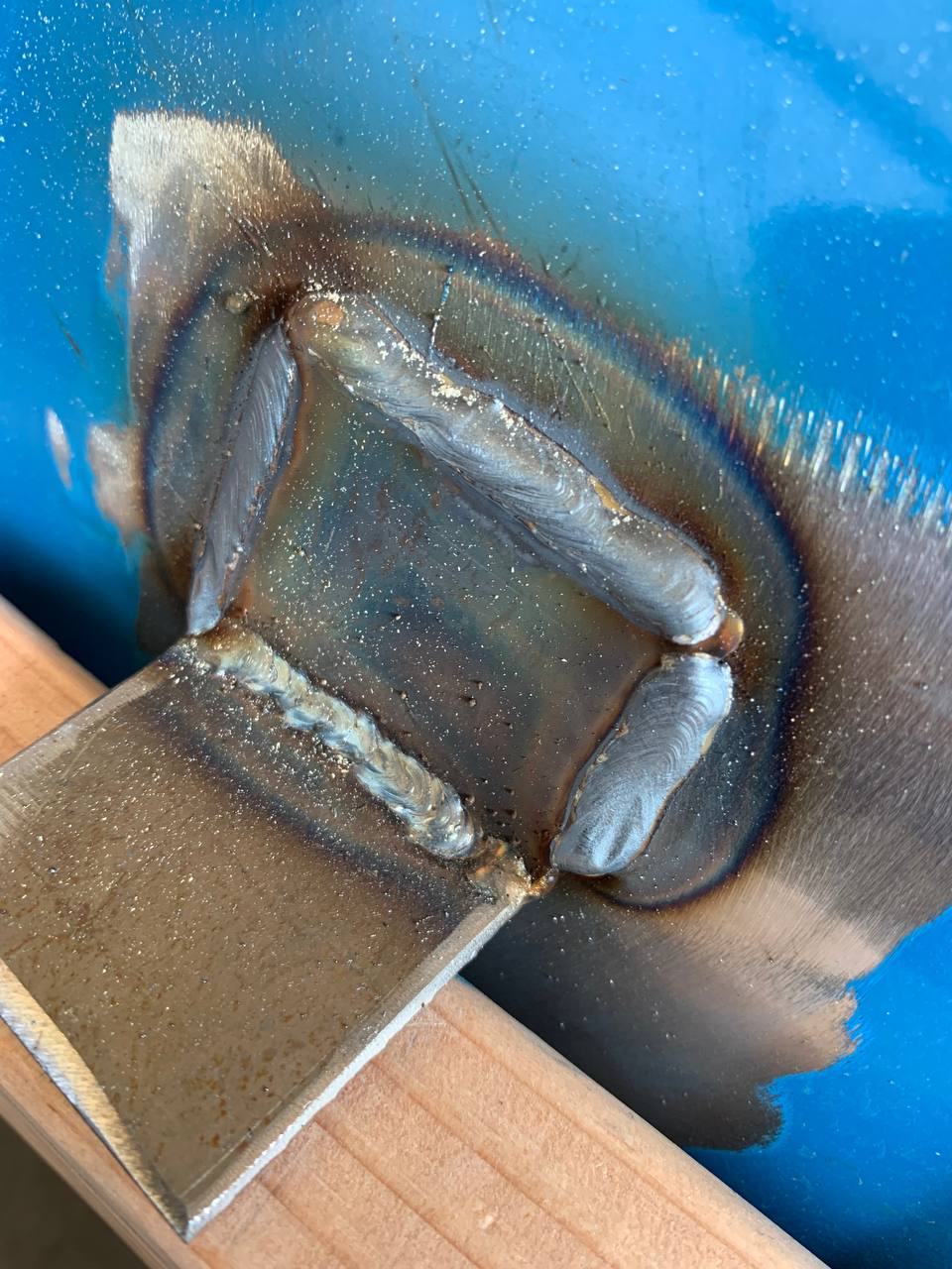 Close up of welded bracket on barrel