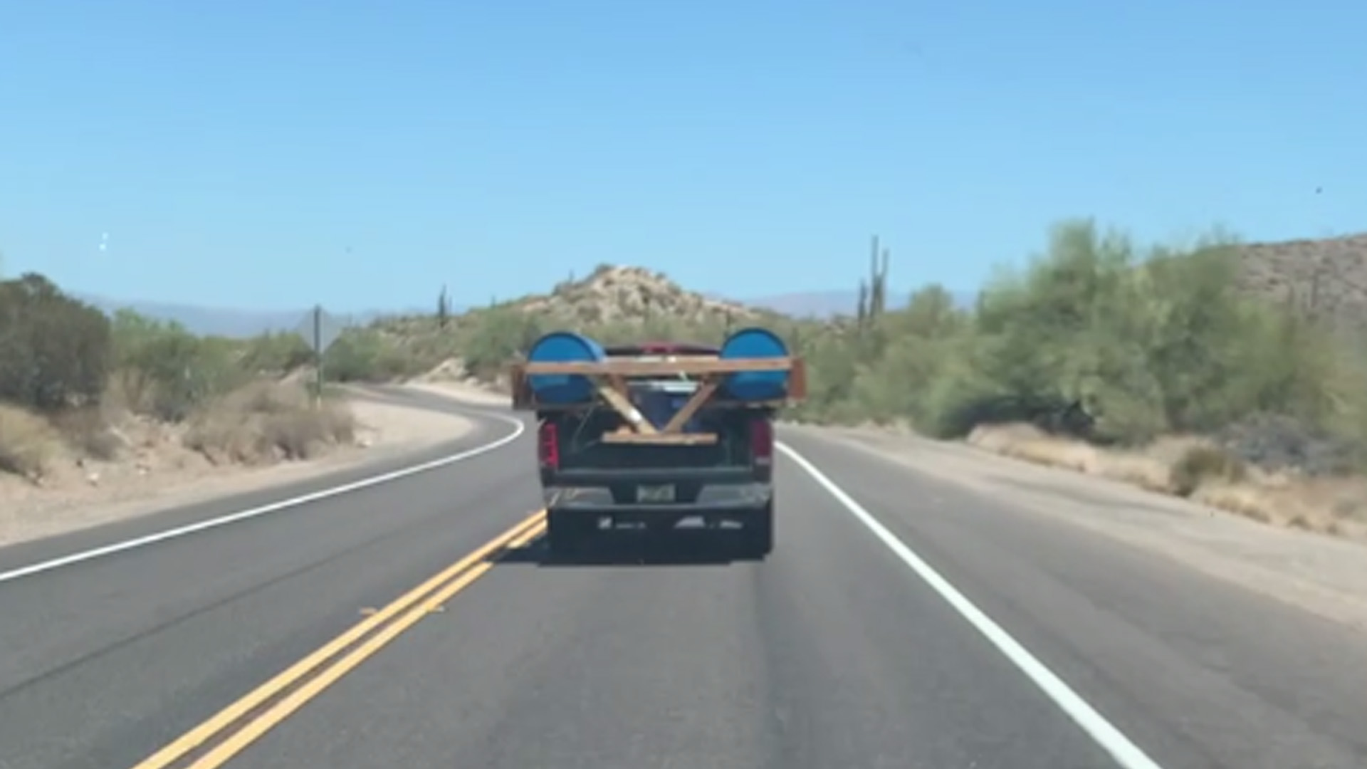 Pontoon loaded in the back of a pickup truck